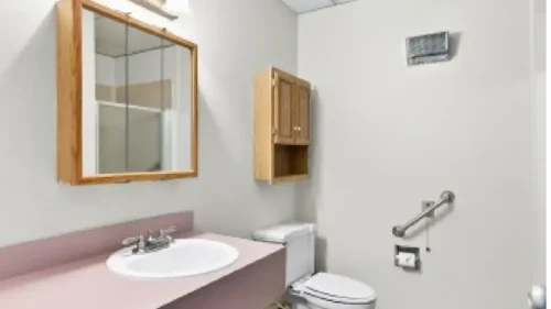 a toilet with mirror